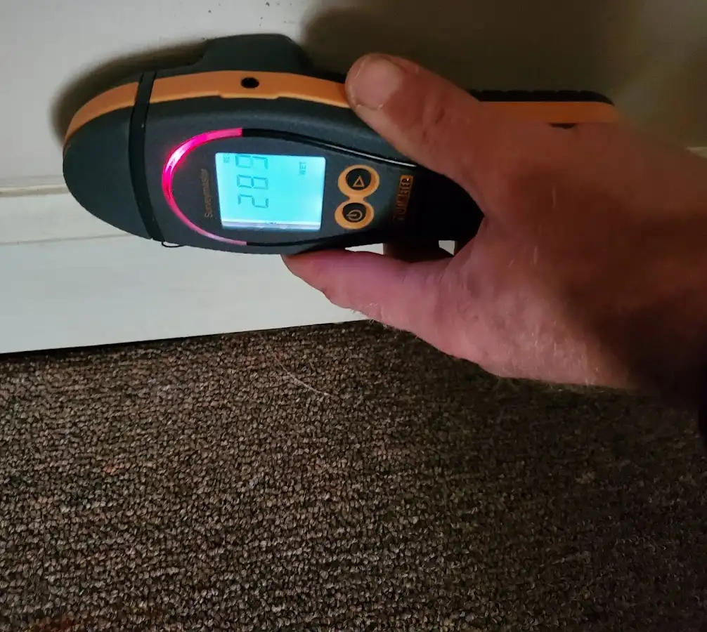Moisture detection at baseboard during Storm Damage Restoration in East Whiteland